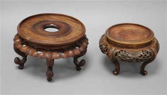Two Chinese hardwood stands largest 20cm diameter